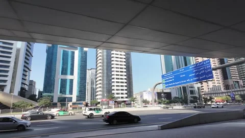 Sheikh Zayed Road in Dubai, bustling with traffic and framed by iconic Stock Footage 298307209