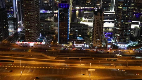 Sheikh Zayed road view with Dubai Marina and Ain Dubai observation wheel Stock Footage 303695601