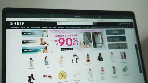 SHEIN website homepage on a computer screen, highlighting online shopping 스톡 동영상 333538210