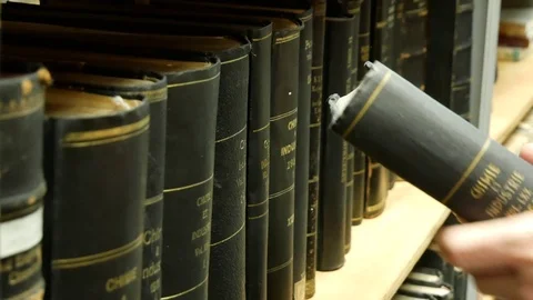 Shelf with books - I found a book in the library Stock Footage 89303079