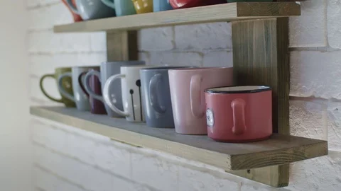 Shelf at coffee shop with cups Stock Footage 129086342