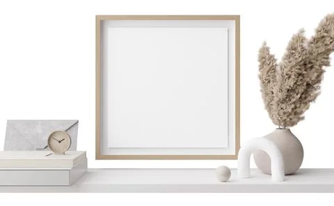A shelf displays various decor items, including a blank frame, a clock, a v.. 写真素材