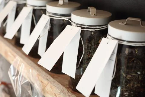 Shelf with jars of tea Stock Photos