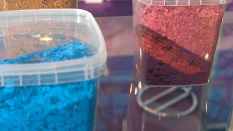 On a shelf, plastic containers with mult... | Stock Video | Pond5