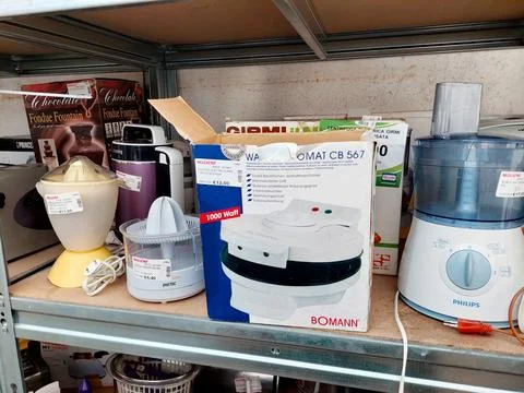 Shelf with second-hand appliances inside a store Stock Photos