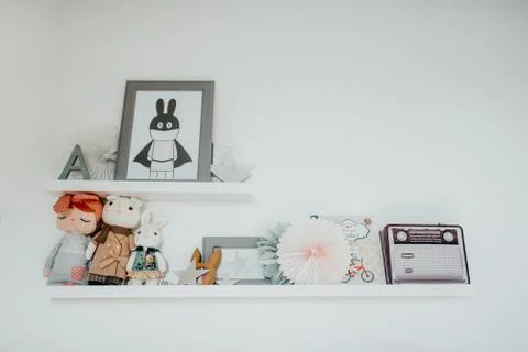 Shelf with toys in children room Stock Photos