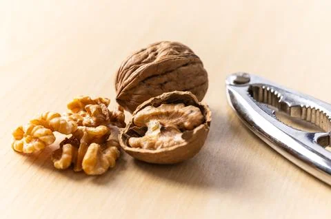 In-shell and shelled walnuts. Production and consumption of walnuts. Stock Photos