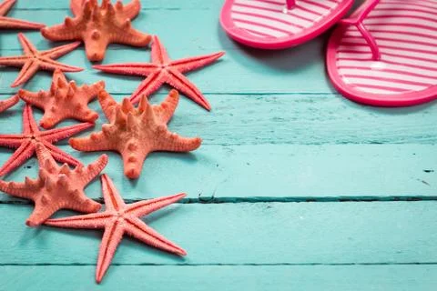 Shell and starfish frame with space on wooden old background. Stock Photos