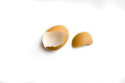 The shell of the broken light brown eggs isolate white background Stock Photos