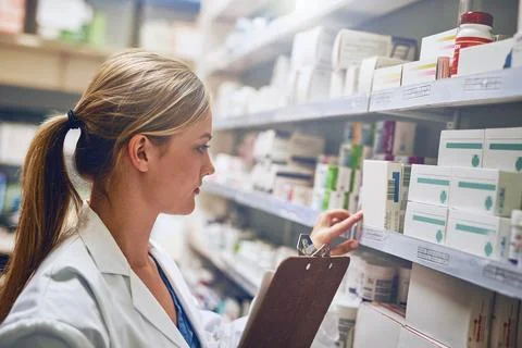 Shell change your live for the better. Shot of a pharmacist looking at Stock Photos