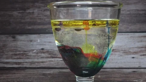 The shell of a chicken egg is dissolved by a vinegar solution Stock Footage 345342852