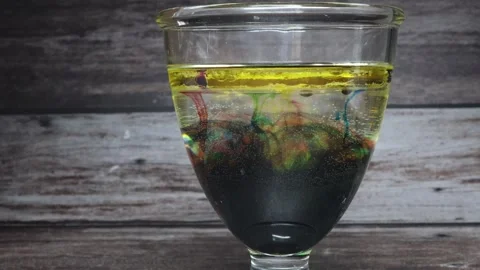 The shell of a chicken egg is dissolved by a vinegar solution Stock Footage 345342873
