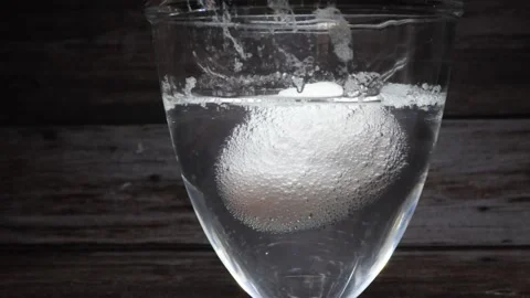 The shell of a chicken egg is dissolved by a vinegar solution Stock Footage 345342913
