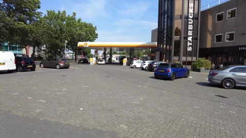 Shell gas station and Starbucks in Netherlands August 15 2022 Stock Footage 296801255