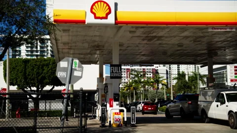 Shell Gas Station in Miami With Fuel Pumps Cars and Urban Street Surroundings Stock Footage 327649512