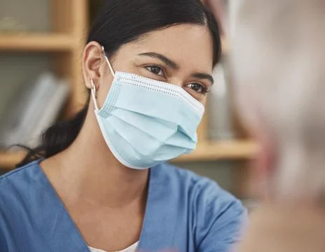 Shell make your health a priority. a young female nurse having a checkup with a Stock Photos