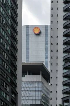 Shell office building, surrounded by skyscrapers. Stock Photos
