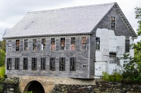 Shell of old spool factory standing on Sebec River Stock Photos
