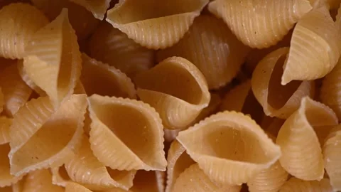 Shell Pasta Conchiglie Spinning on Plate. Top-Down Seamless Motion Loop Stock Footage 325424736