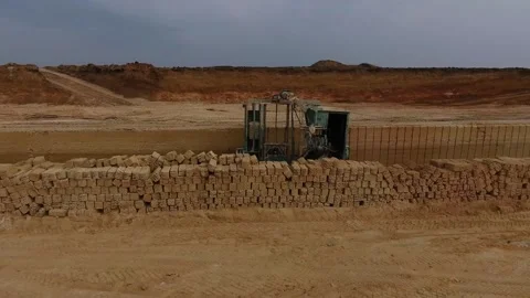 Shell quarry quarry. Cutting a seashell into blocks right away in quarry. Stock Footage 239262729