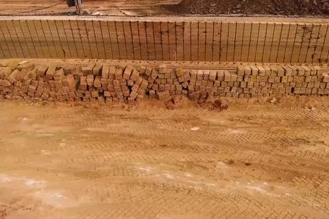 Shell quarry quarry. Cutting seashell into blocks right away in a quarry. Stock Photos