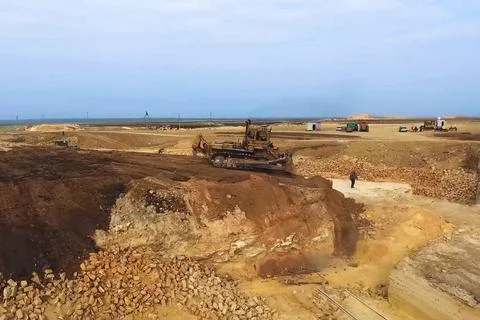Shell quarry quarry. Cutting seashell into blocks right away in a quarry. Stock Photos