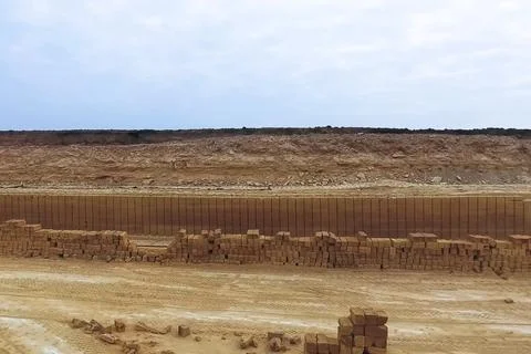 Shell quarry quarry. Cutting seashell into blocks right away in a quarry. Stock Photos