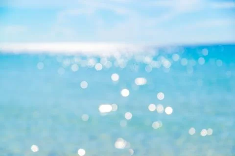 Shell on sand at beach and blue sky and bokeh sea. Stock Photos