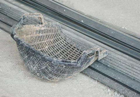 Shell shaped basket is used for brick, stone, soil, sand for construction. Co Stock Photos