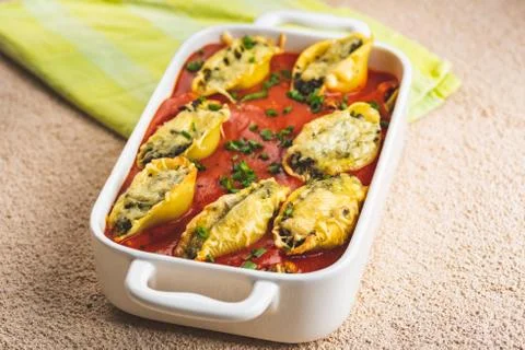 Shell-shaped pasta stuffed with spinach and cheese Stock Photos