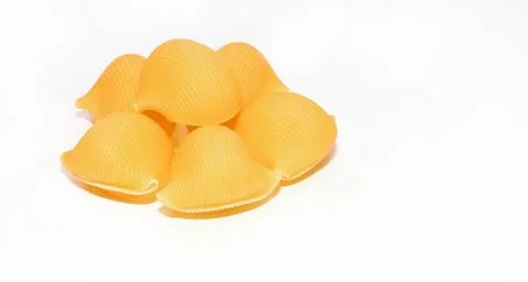 Shell shaped pasta on a white background. A modern set for healthy eating, gr Stock Photos