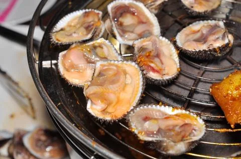 Shell steaks on the grill Stock Photos