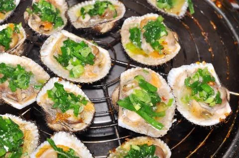 Shell steaks on the grill Stock Photos