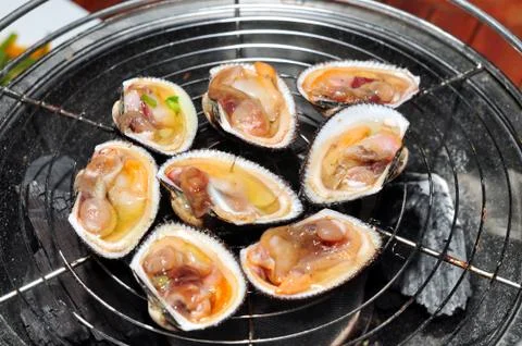 Shell steaks on the grill Stock Photos