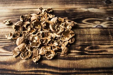 Shell of walnuts on wooden background Stock Photos