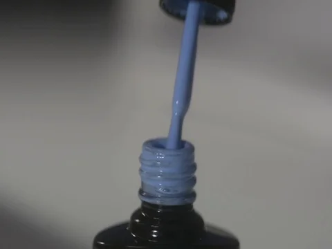 Shellac nail polish in blue. Close-up Stock Footage 121439771