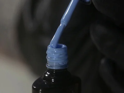 Shellac nail polish in blue. Close-up Stock Footage 121439890