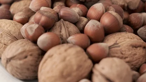 Shelled nuts and shelled walnuts on the rotating stand, Stock Footage 126788704