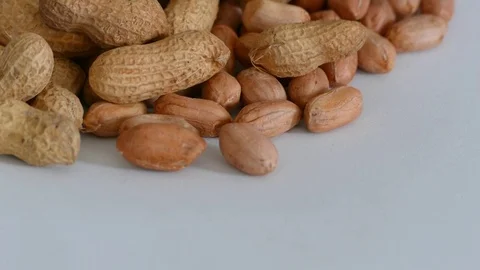 Shelled peanuts,crusty raw groundnut, hd video, on white background 動画素材 100891320