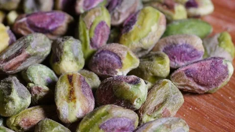 Shelled Pistachio nuts rotating Stock Footage 76437981