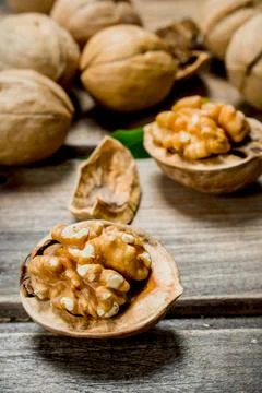 Shelled walnut with green leaves. Stock Photos