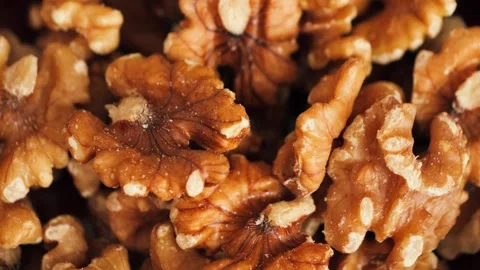 Shelled walnuts close-up, healthy snack rich in vitamins, omega-3 and nutrients. Stock Footage 335712804