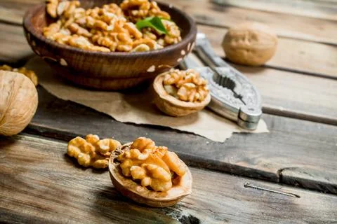 Shelled walnuts with a Nutcracker. Stock Photos