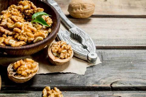 Shelled walnuts with a Nutcracker. Stock Photos