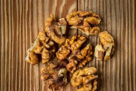 Shelled walnuts on rustic  table Stock Photos