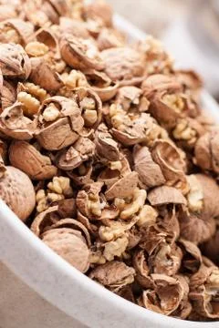 Shelling walnuts in the kitchen Stock Photos