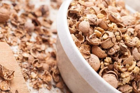 Shelling walnuts in the kitchen Stock Photos