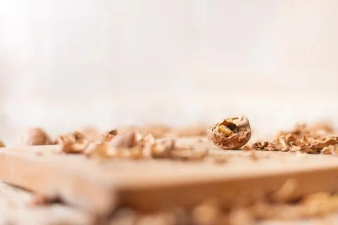 Shelling walnuts in the kitchen Stock Photos