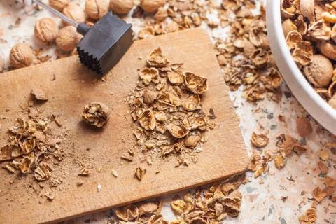Shelling walnuts in the kitchen Stock Photos