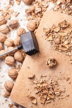 Shelling walnuts in the kitchen Stock Photos